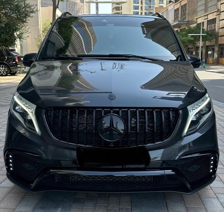 Blacked-out executive van, discreet ground transfer